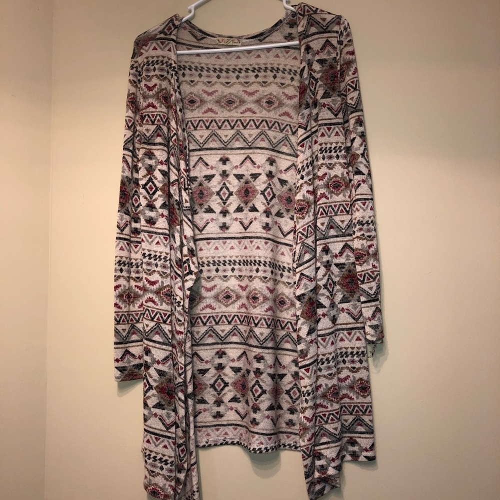 maroon, black, tan, and brown cardigan